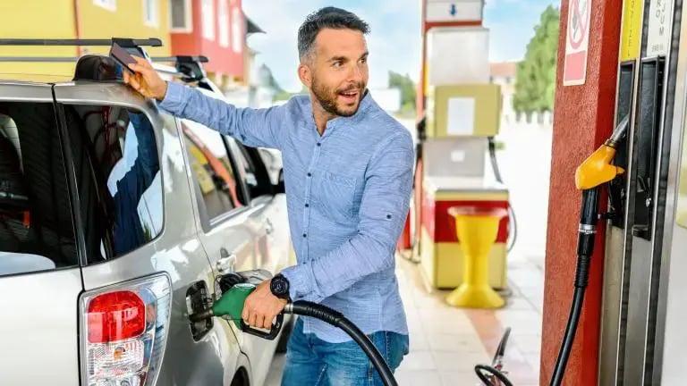 underscored-man-at-gas-pump-with-credit-card-768x432